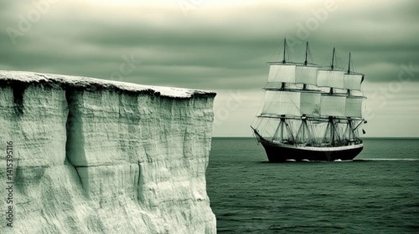 Obraz A majestic sailing ship navigating stormy seas near a dramatic icy cliff