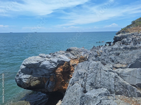 Fototapeta The beak of a limestone cliff at Cape Chakraphong (Cape Tha Phang), Koh Sichang island, Chonburi, Thailand. The top sights in Ko Sichang Island