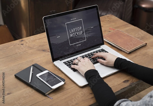 Fototapeta User with Laptop on Desk Mockup 1