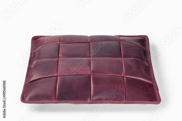 Fototapeta Burgundy leather cushion floating on white background: modern home decor