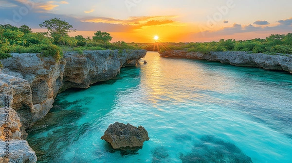 Fototapeta Turquoise waters flow between rocky cliffs under a golden sunset natures beauty and serenity is showcased