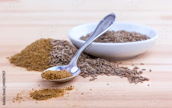 Obraz raw and crushed cumin
