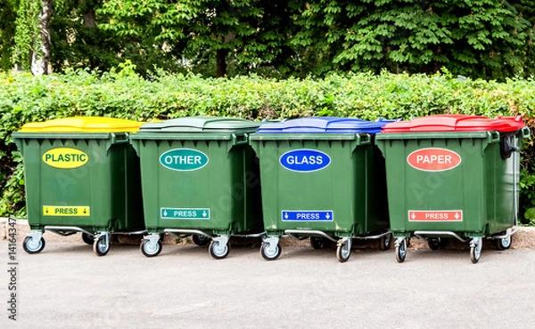 Fototapeta Plastic garbage containers for separate collection of waste