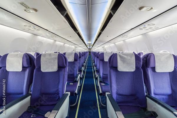 Fototapeta Empty passenger airplane seats in the cabin