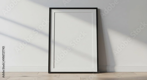 Fototapeta Poster mockup in a frame, leaned against a white wall