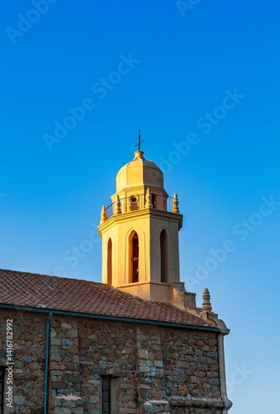Fototapeta Greek church Saint-Spyrido, Cargèse, Corsica, France. Typical and picturesque hillside village. Hilltop town nestled on the coast above the Mediterranean sea.