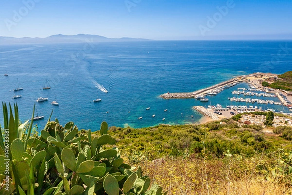 Fototapeta The harbour of Cargèse, Corsica, France, typical and picturesque hillside village. Hilltop town nestled on the coast above the Mediterranean sea.