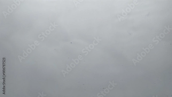 Fototapeta Rain drops falling on window glass creating relaxing atmosphere