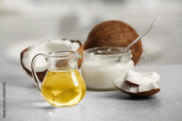 Obraz Fresh coconut oil in glassware on grey table