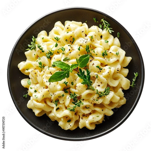Fototapeta Top view of a delicious looking Spätzle mit Zwiebeln on a dark plate isolated on a white transparent background
