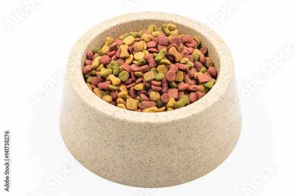 Fototapeta Dog food in a bowl on white background.