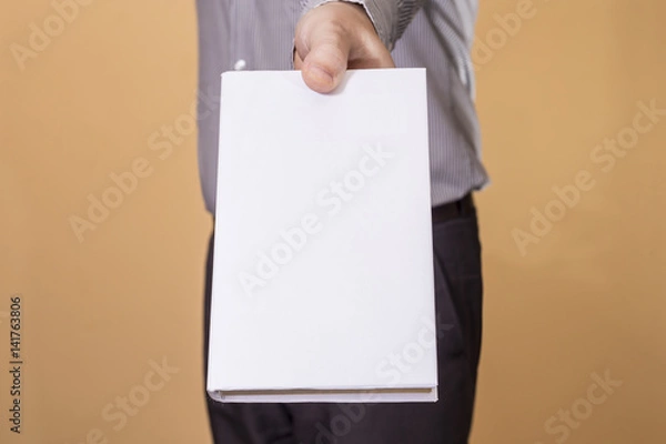 Obraz Man holding a blank book