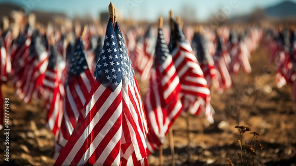 Fototapeta American Flags: A field of American flags waving in the wind, symbolizing freedom, patriotism, and national pride.  A symbolic and patriotic scene.