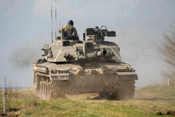 Fototapeta close-up of a commander directing a Challenger 2 II FV4034 main battle tank, reversing away at high speed