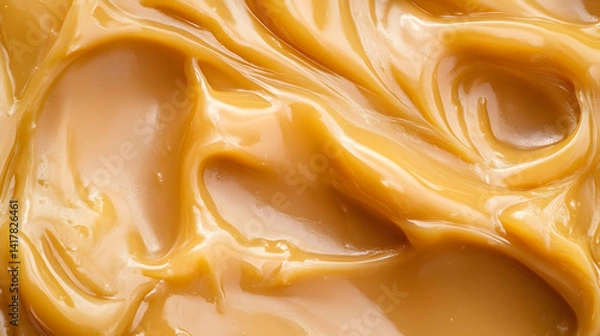 Fototapeta Delicious caramel swirl texture close-up presents appetizing confectionery delight