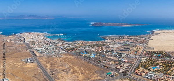 Obraz Stunning high level aerial panoramic landscape image of the town of Corralejo, harbor and Lobos Island, Fuerteventura, Canary Islands, Spain