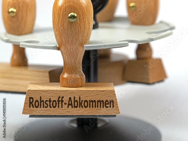 Fototapeta Stempel mit dem Aufdruck Rohstoff-Abkommen in einer Nahaufnahme
