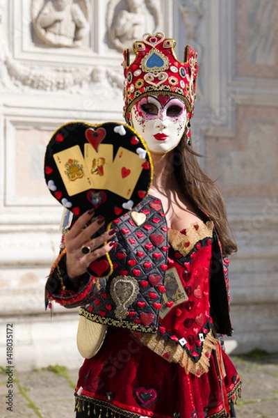 Obraz Venice, Italy - People dressed in carnival masks are photographed by tourists in the scenery of the ancient Venetian palaces