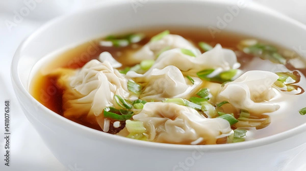 Fototapeta Delicious, Ultra-Realistic Bowl of Chinese Dumplings with Broth and Green Onions Captured in High Detail