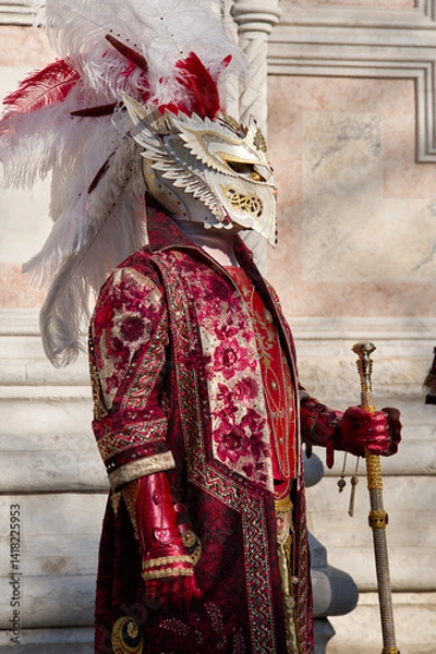 Obraz Venice, Italy - People dressed in carnival masks are photographed by tourists in the scenery of the ancient Venetian palaces