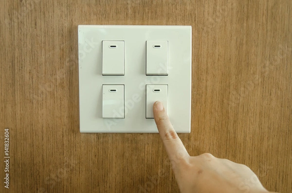 Obraz Finger press on light button