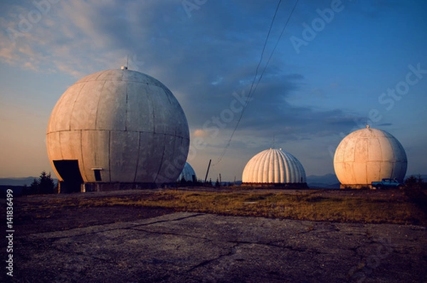 Fototapeta The old military facility is a tracking system. Radar base when it rains.