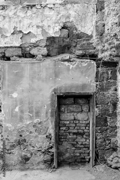 Fototapeta bricked old door