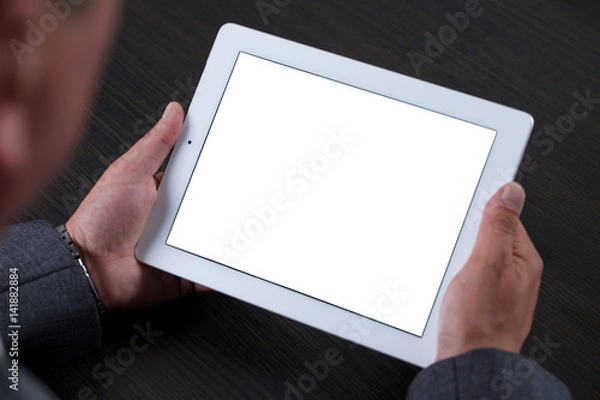 Fototapeta Close up of man using tablet. White screen.