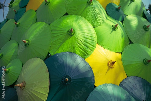 Obraz Multi-colored umbrellas are lined up.