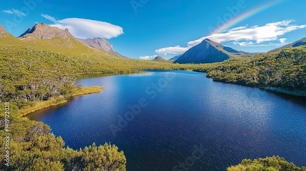 Fototapeta Cradle Mountain landscape featuring still lake reflecting vibrant blue sky