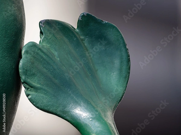 Obraz A model of a green leaf, set against a blurred background.