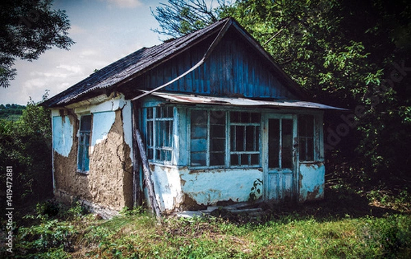 Fototapeta Old wooden clay house. Ancient building made of clay. Ruins