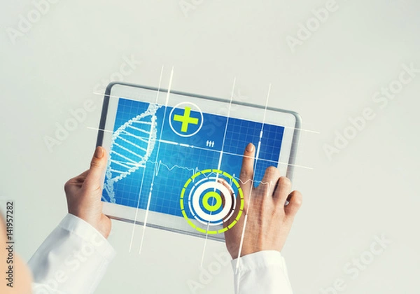Fototapeta Close of female doctor hands working with tablet pc computer