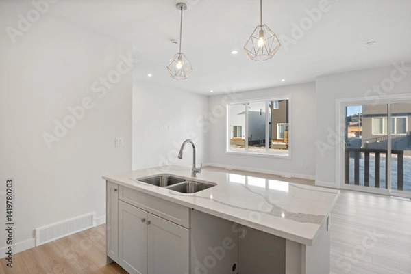 Fototapeta Kitchen with a white countertop and two sinks