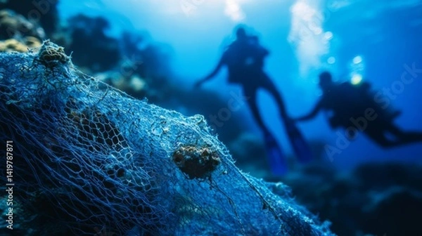 Obraz Ghost Net Entangled in Coral with Divers Behind
