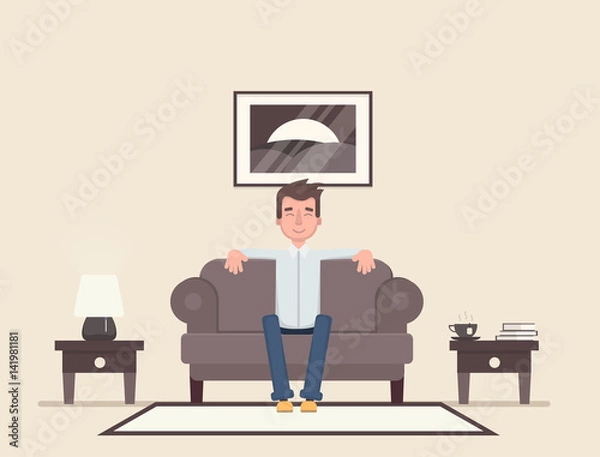 Fototapeta The man is sitting in the room and resting.