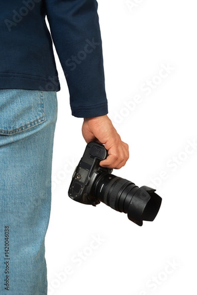 Fototapeta Person holding a professional camera while wearing casual clothing in a relaxed setting, isolated on transparent background