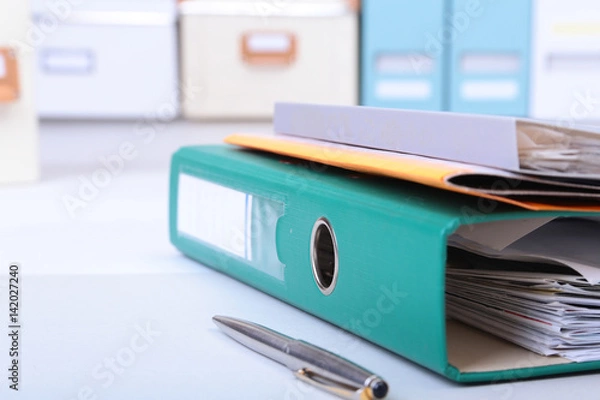 Obraz Folder file, pen, pencil and note on the desk. blurred background.