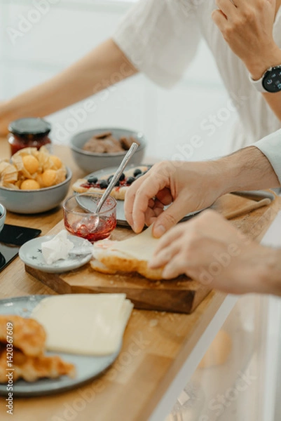 Obraz A couple having breakfast in the kitchen