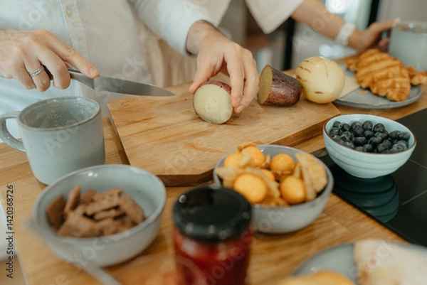Obraz A couple having breakfast in the kitchen