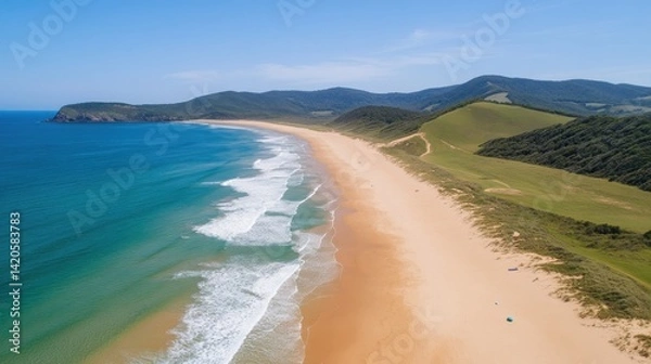 Fototapeta Panoramic view of a tranquil beach and coastline.