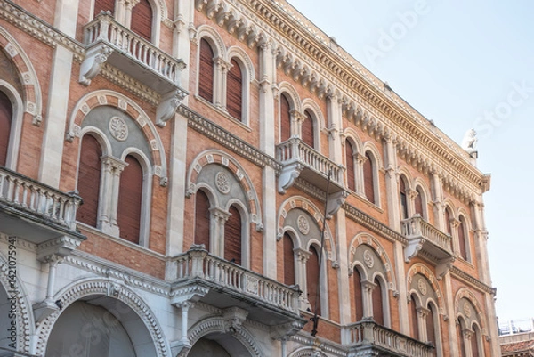 Fototapeta Facade of beautiful building Palazzo delle Debite in central Padova built in neo-romanesque style with vaulted bifora windows and decorative cornices