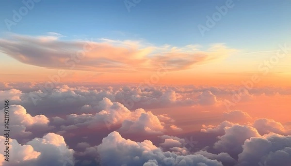 Fototapeta Beautiful sunset scene showing a vast sky filled with soft fluffy clouds illuminated by warm orange and pink sunlight, creating a peaceful and glowing atmosphere above the horizon