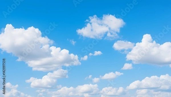 Obraz Clear blue sky filled with soft, fluffy white clouds floating gently, creating a bright and peaceful atmosphere on a sunny day with natural daylight