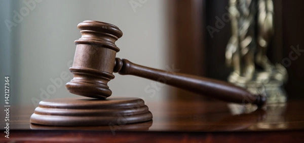 Fototapeta Closeup of gavel in court room