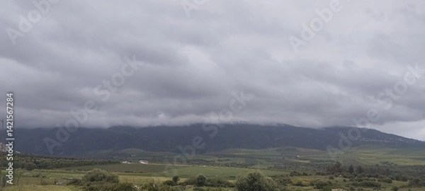 Obraz storm clouds over the mountains