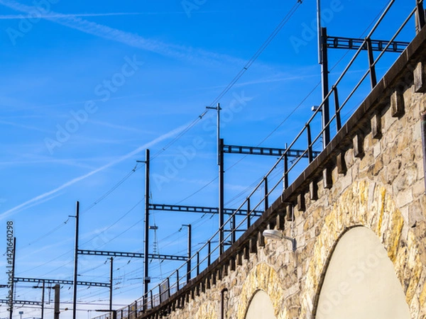 Obraz Stone Railway Viaduct in Zurich with Overhead Power Lines