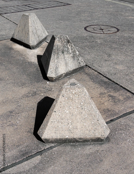 Obraz Concrete Pyramids on Pavement in urban setting