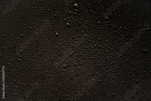 Fototapeta background texture for black background with shimmering elements and flowing drops on glass, with overflows and bokeh, beautiful bright background with overflows and gradient