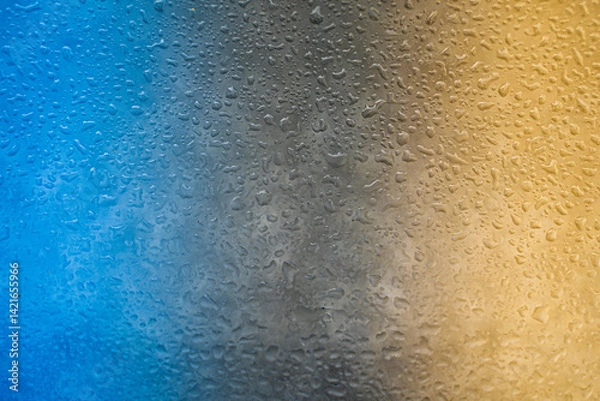 Fototapeta background texture for background bright blue water and sea, black and yellow with shimmering elements and flowing drops on glass, beautiful bright background with iridescent and gradient